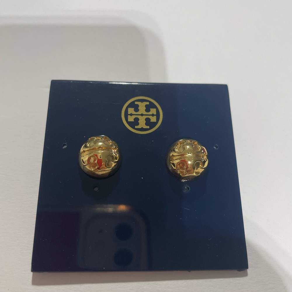 Like new Tory Burch earrings with logo. Round dome shape. Gold color. Post back